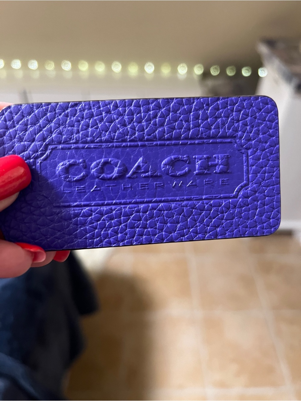 Coach Purple Pebbled Leather Tag